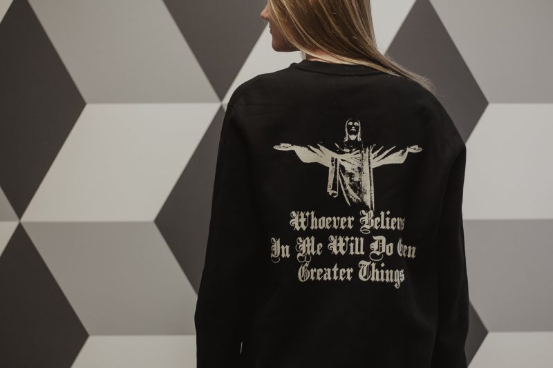 woman wearing black greater things sweatshirt