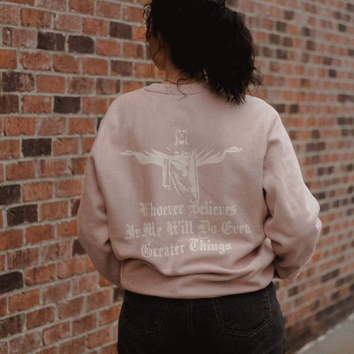 woman wearing pink greater things sweatshirt back